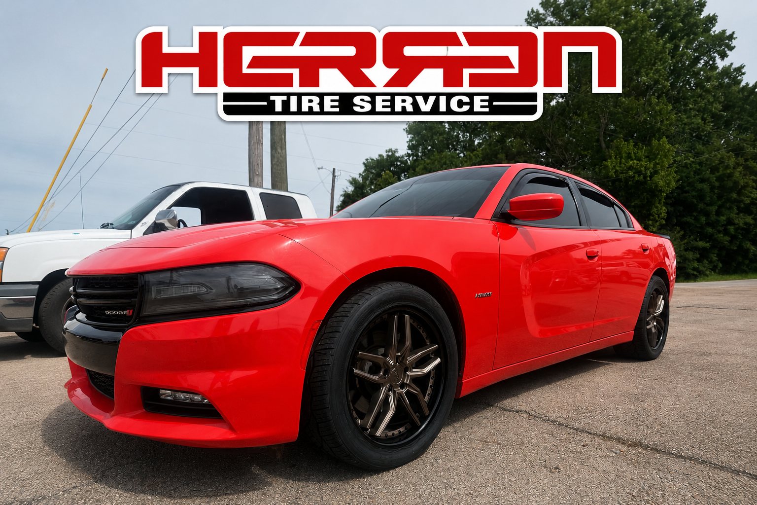 Orange Dodge Charger with custom 18-inch Niche wheels installed at Herren Tire Service in Paragould, Blytheville, Brookland, and Northeast Arkansas, featuring premium aftermarket wheels, performance upgrades, and expert wheel and tire services. 