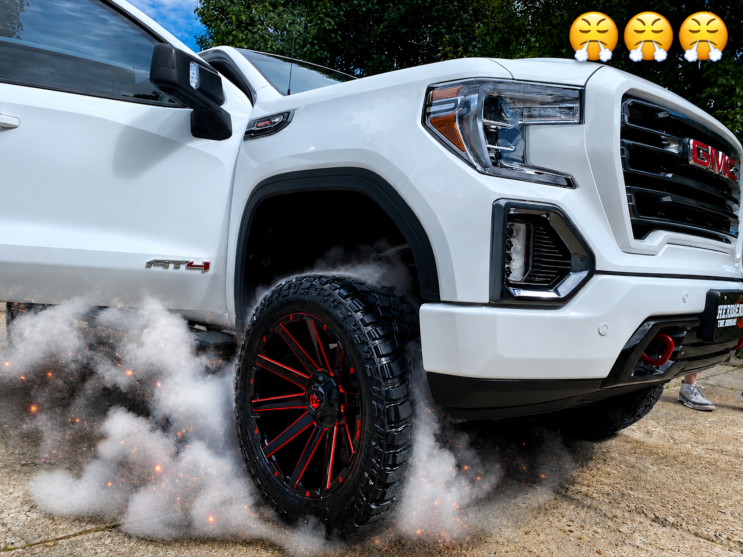 2018 GMC Sierra AT4 featuring a 3.5-inch Rough Country lift kit, 35x12.50R22 Cooper Discoverer STT Pro mud-terrain tires, and a Fuel Contra gloss black wheels with red accents, professionally customized by Herren Tire Service. Showcasing premium off-road truck upgrades, aftermarket wheels, suspension enhancements, lift kit installation, and custom truck accessories in Northeast Arkansas.